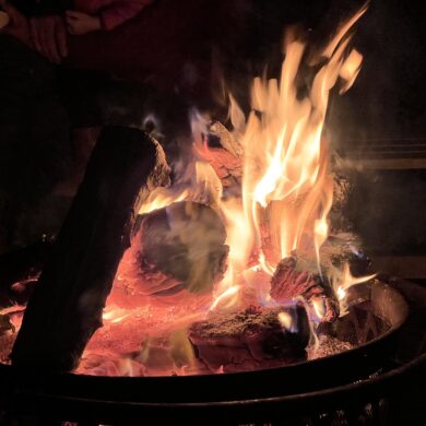 fire burns in a controlled pit